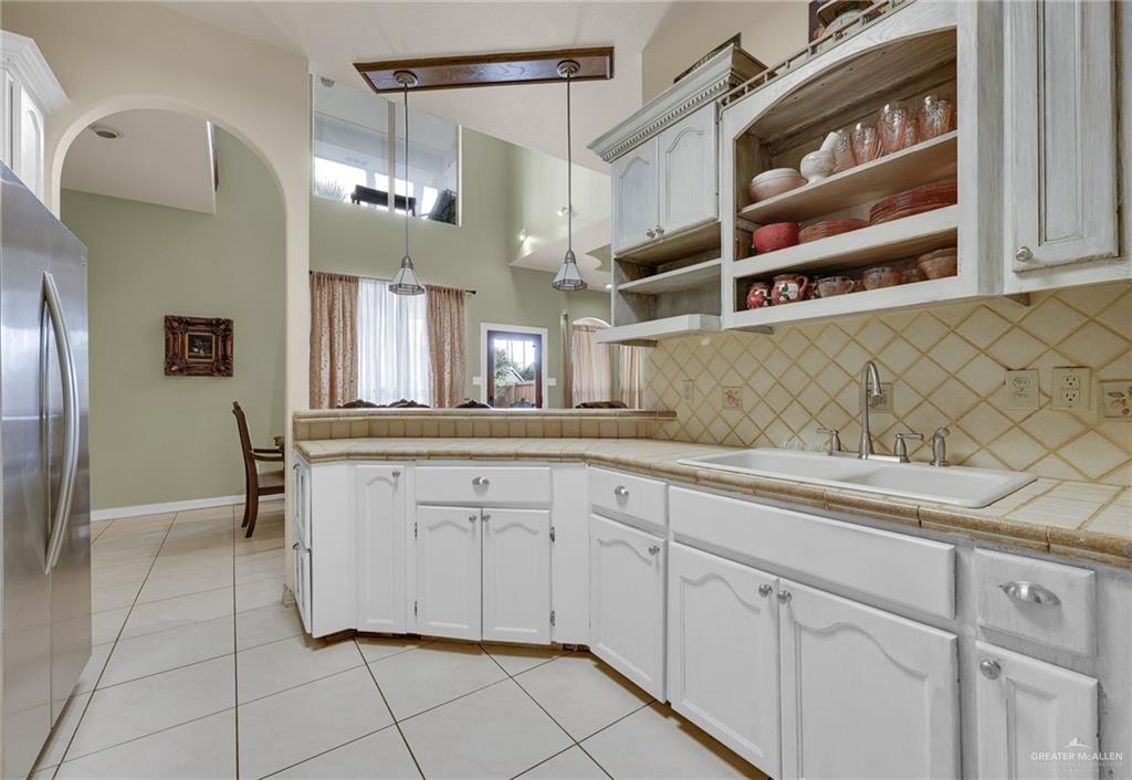 1107 Harbor Lane La Joya, TX 78560 - Photo 8 of 29 a kitchen with cabinets and window