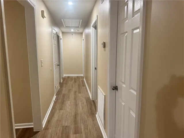 a view of a bathroom from a hallway