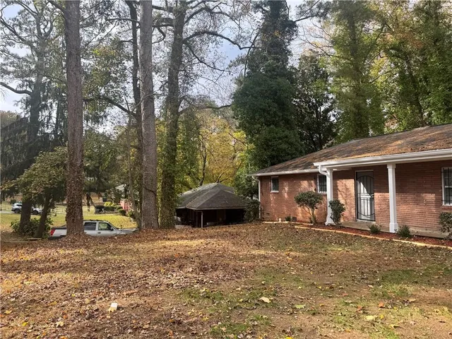 a house with trees in front of it