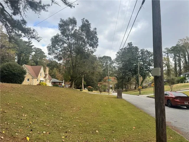a view of a street with a tree