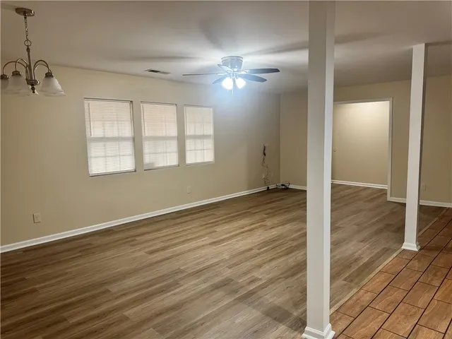 a view of a livingroom with wooden floor
