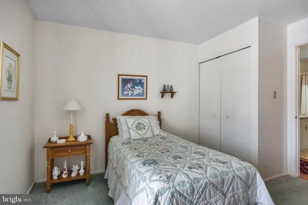 a bedroom with a bed and a table