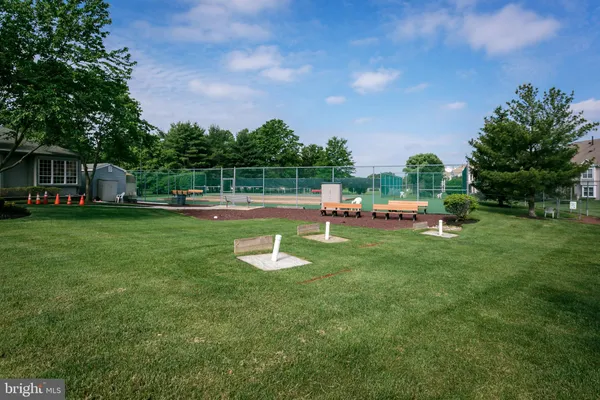 a view of a house with a backyard porch and sitting area