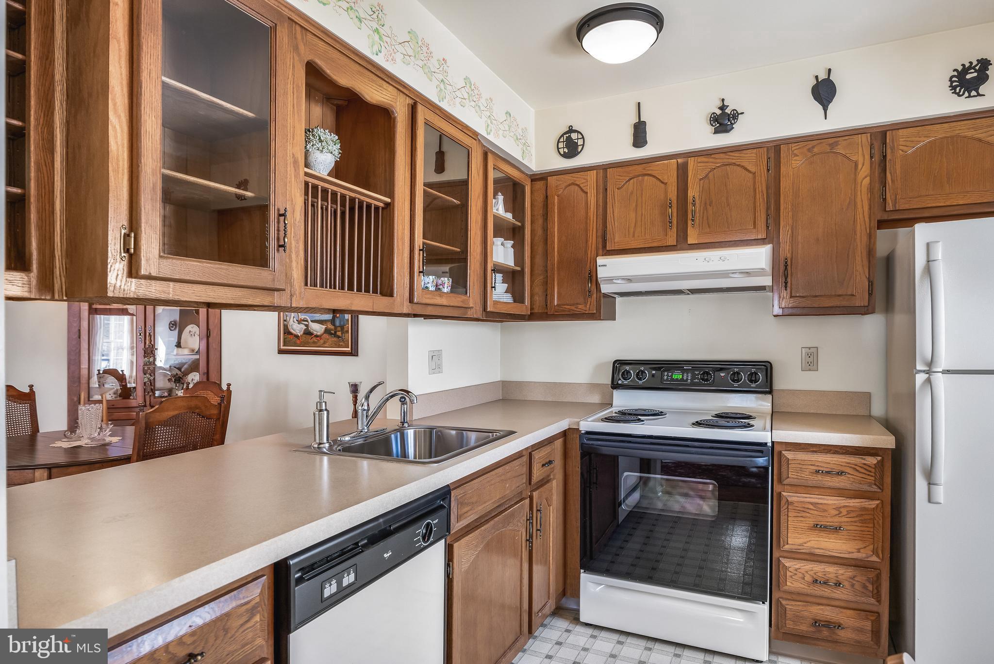 3522B Neils Court Mount Laurel, NJ 08054 - Photo 7 of 25 a kitchen with stainless steel appliances granite countertop a sink stove and cabinets
