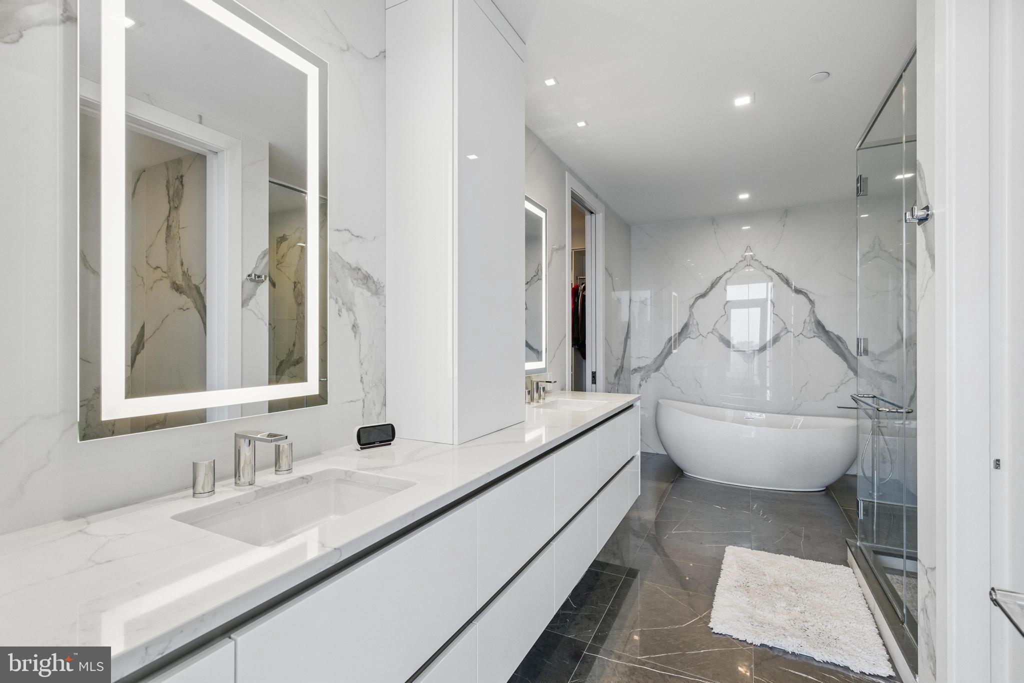1911 Walnut Street, Unit 3304 Philadelphia, PA 19103 - Photo 13 of 35 a bathroom with a sink a toilet and a mirror