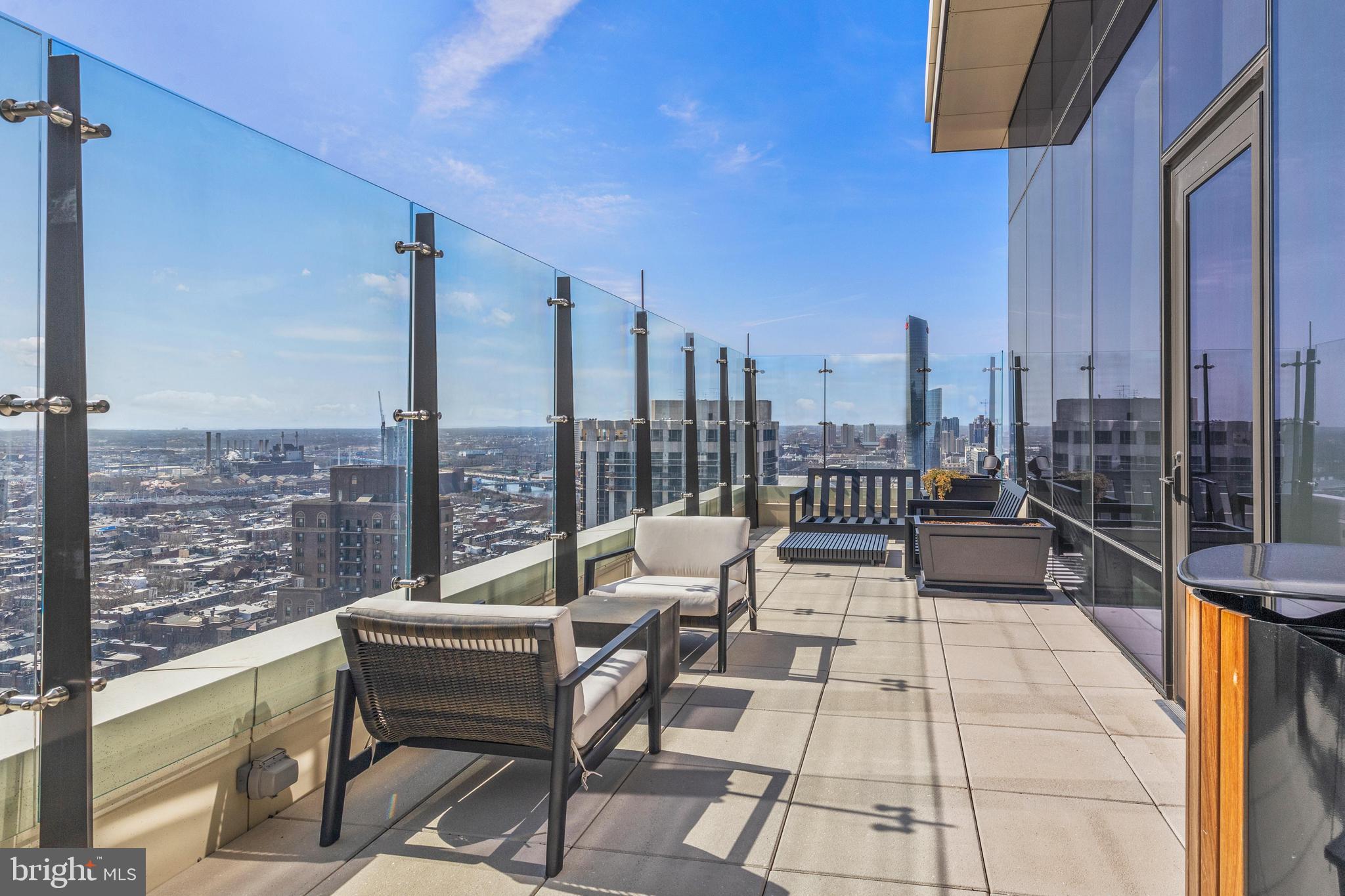 1911 Walnut Street, Unit 3304 Philadelphia, PA 19103 - Photo 29 of 35 a balcony with furniture and a view of city