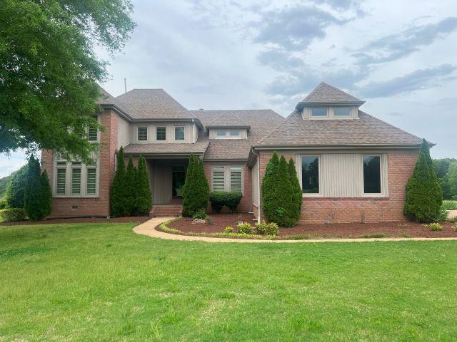 2055 Bobbitt Road Williston, TN 38076 - Photo 1 of 40 View of front facade featuring brick siding and a front lawn