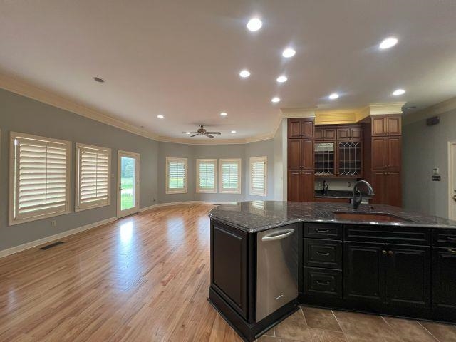 2055 Bobbitt Road Williston, TN 38076 - Photo 40 of 40 Kitchen with crown molding, open floor plan, a sink, and dishwasher