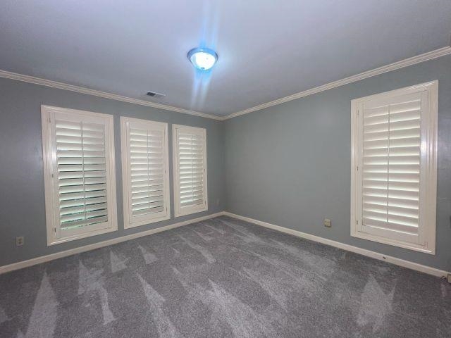 2055 Bobbitt Road Williston, TN 38076 - Photo 12 of 40 Unfurnished room featuring crown molding, carpet floors, baseboards, and visible vents