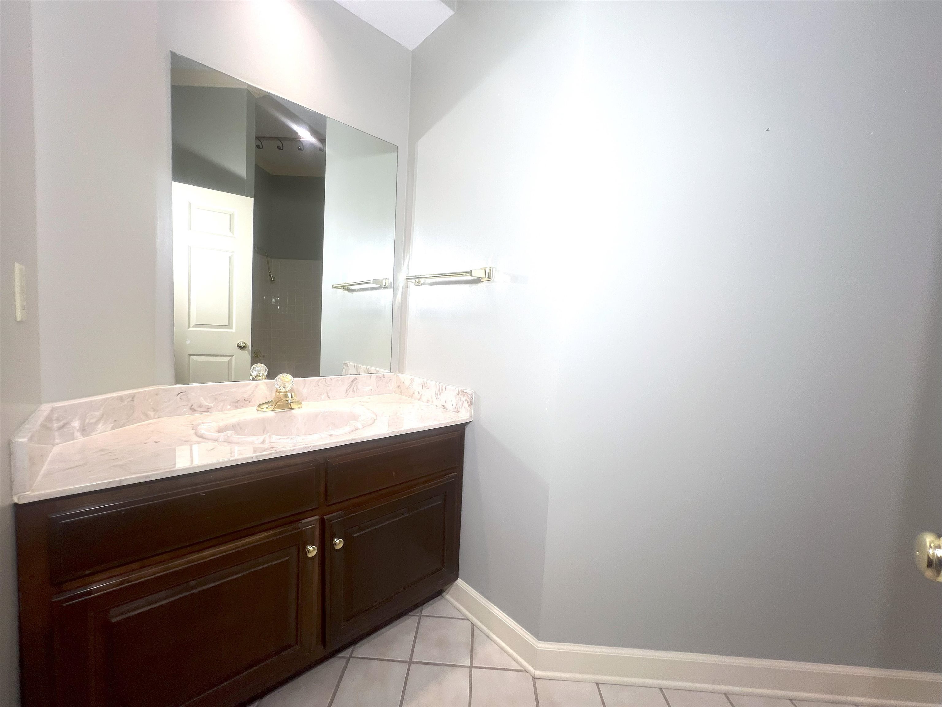 2055 Bobbitt Road Williston, TN 38076 - Photo 22 of 40 Bathroom featuring tile patterned floors, baseboards, and vanity