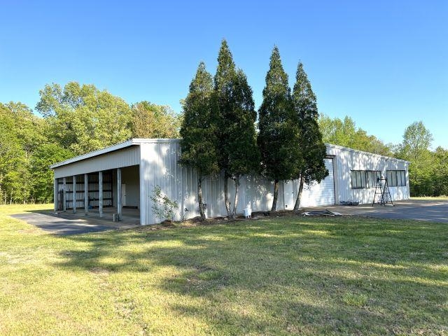 2055 Bobbitt Road Williston, TN 38076 - Photo 33 of 40 Exterior space with a lawn, an outdoor structure, and an outbuilding