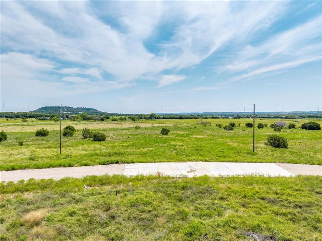 1307 Hidden Vly Road Glen Rose, TX 76043 - Photo 24 of 25 a view of a big yard with a large trees