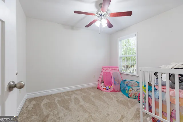 a bedroom with furniture and a window