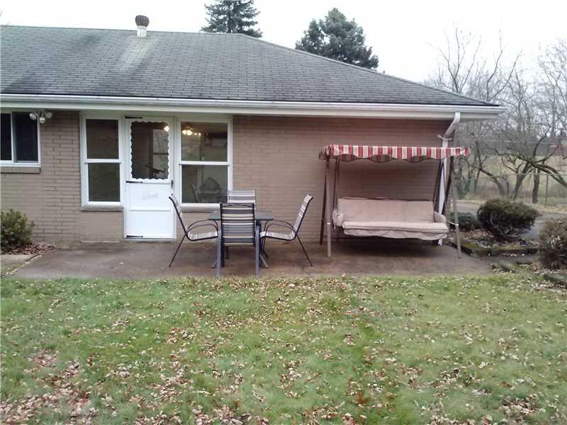 1758 Washington Road Apollo, PA 15613 - Photo 13 of 17 Exterior Front. Spacious patio at the back of the breezeway.