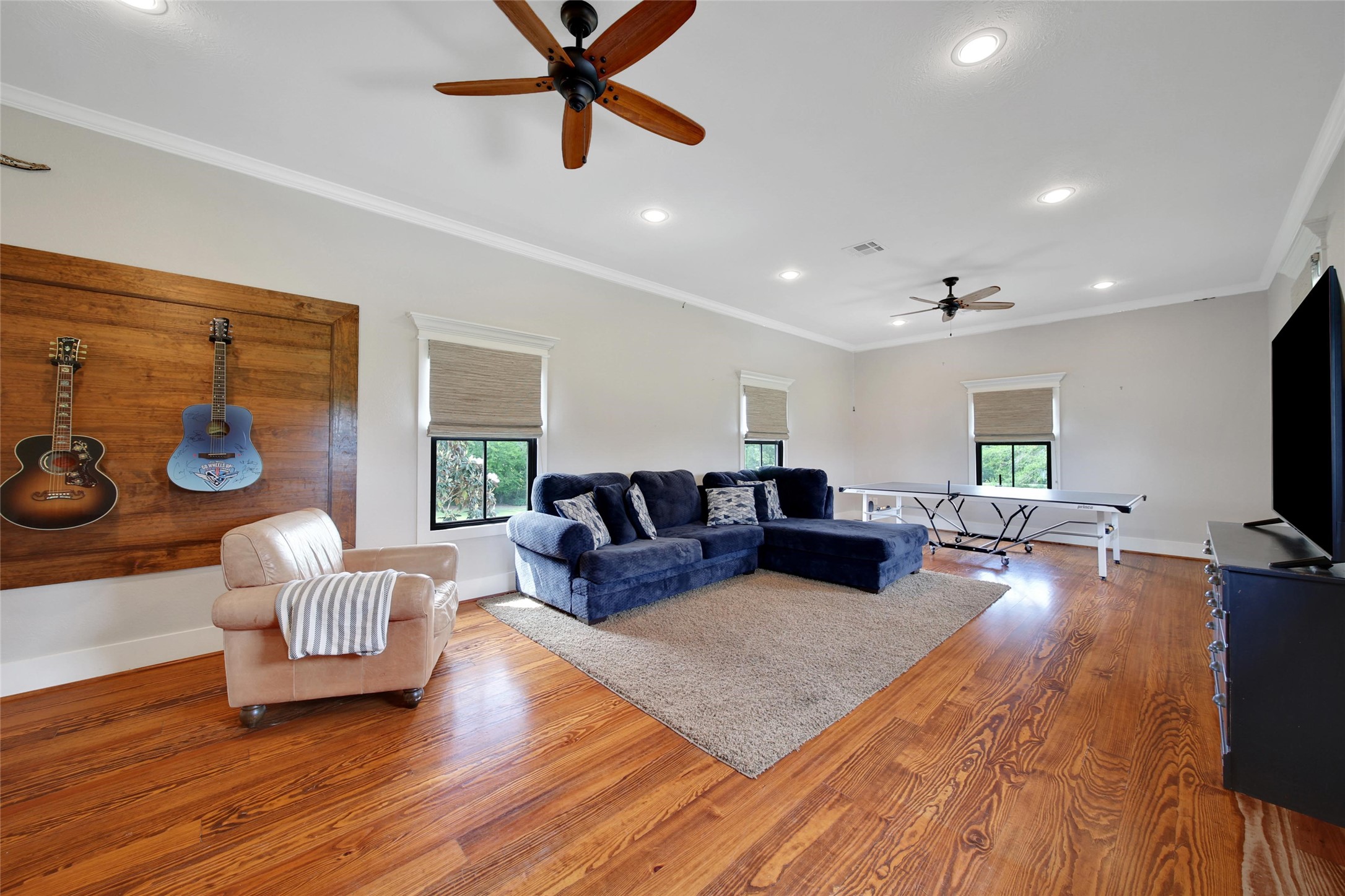18875 Rabon Chapel Road Montgomery, TX 77316 - Photo 18 of 45 a living room with furniture and a flat screen tv