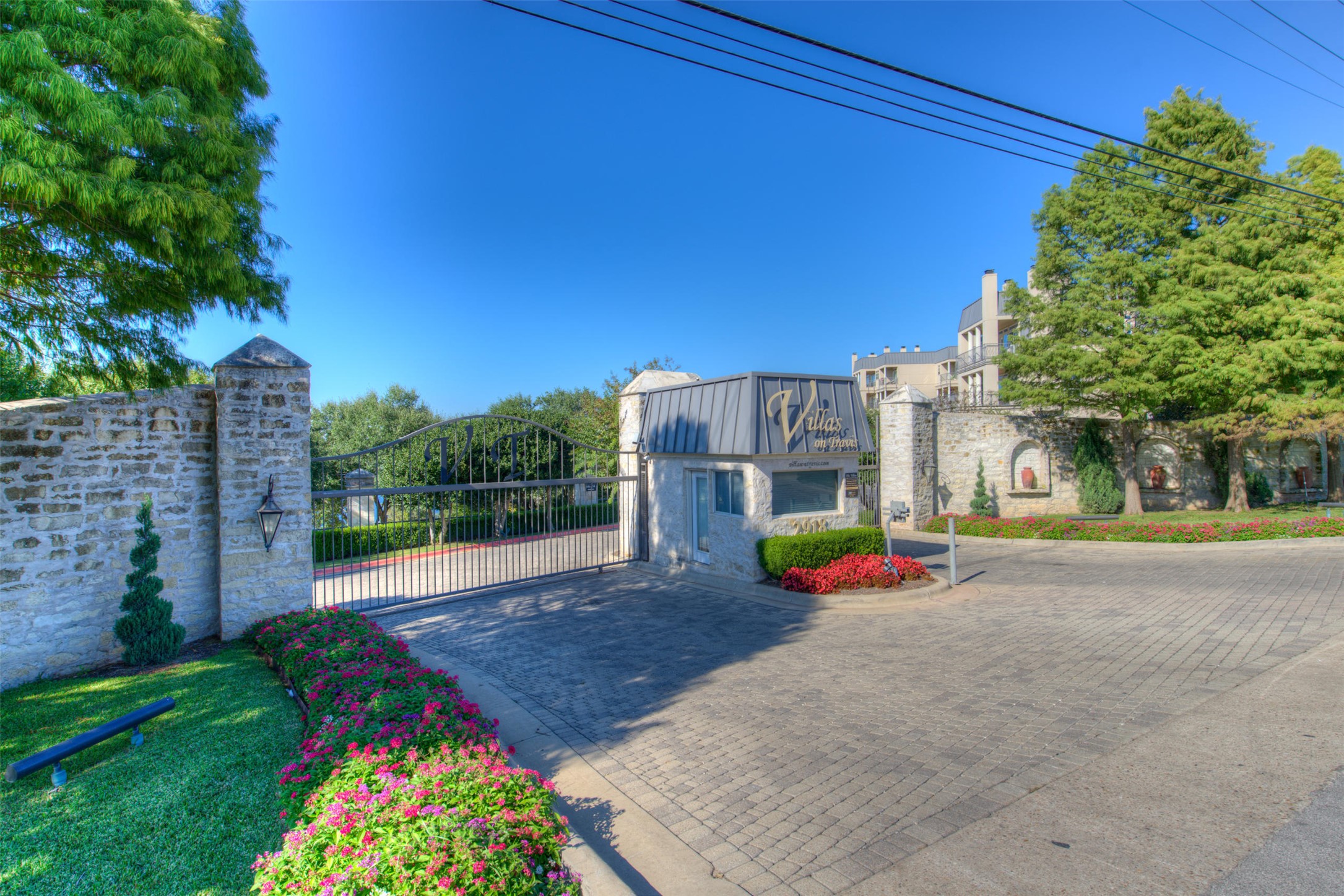 2918 Ranch To Market Road 620, Unit O282 Austin, TX 78734 - Photo 2 of 40 View of street with a gate, a gated entry, and curbs