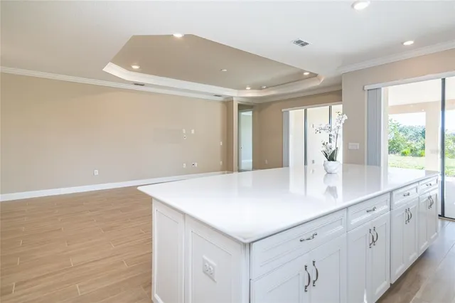 a kitchen with stainless steel appliances a sink stove refrigerator and cabinets