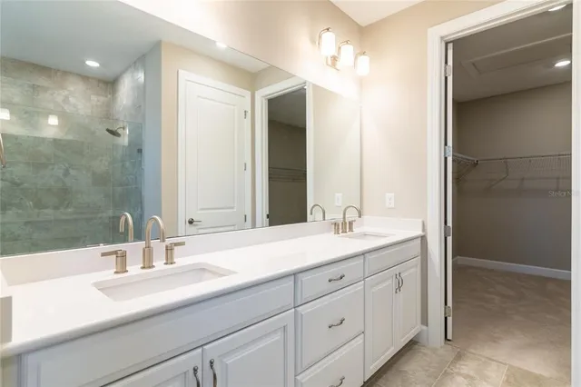 a bathroom with a double vanity sink and a mirror