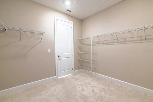 a view of a room with racks on the wall