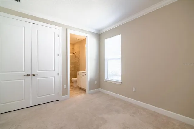 a bathroom with a sink toilet a mirror and shower