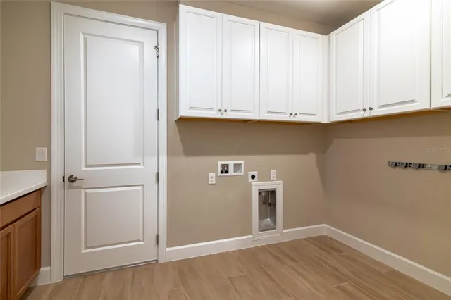 a view of cabinets and wooden floor