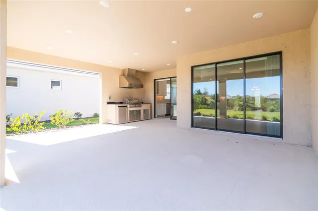 a kitchen with a sink and a large window