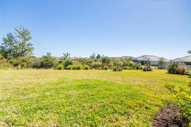 an aerial view of a house with a ocean view