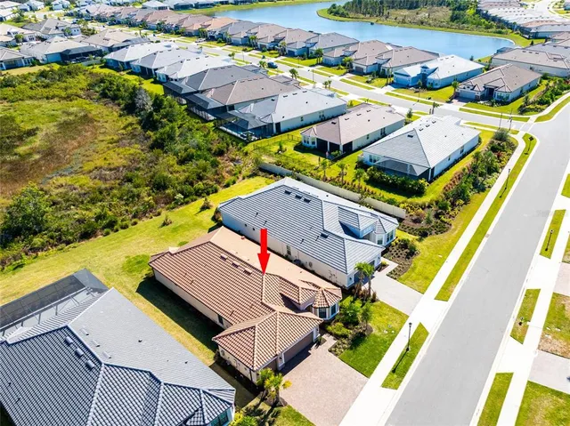 an aerial view of a house with a swimming pool