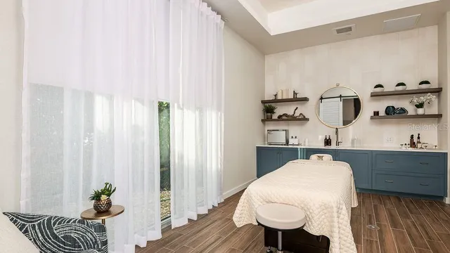 a living room with furniture kitchen view and a flat screen tv