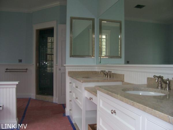 243 Katama Road Edgartown, MA 02539 - Photo 3 of 6 a bathroom with a sink and a mirror
