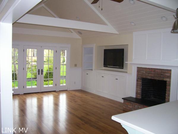 243 Katama Road Edgartown, MA 02539 - Photo 5 of 6 a view of an empty room with wooden floor and a fireplace