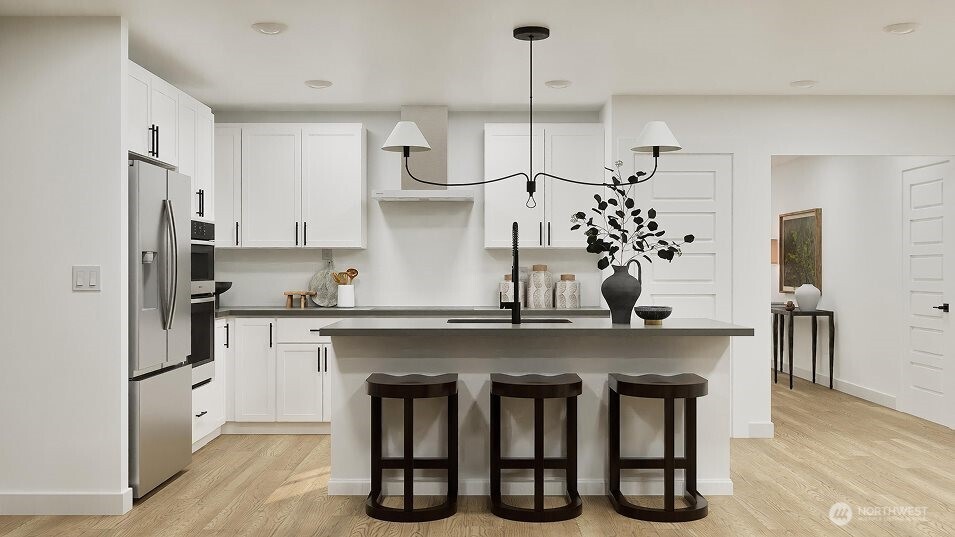 547 Silver Frost Drive Sequim, WA 98382 - Photo 2 of 15 a kitchen with stainless steel appliances a sink a stove a refrigerator and center island