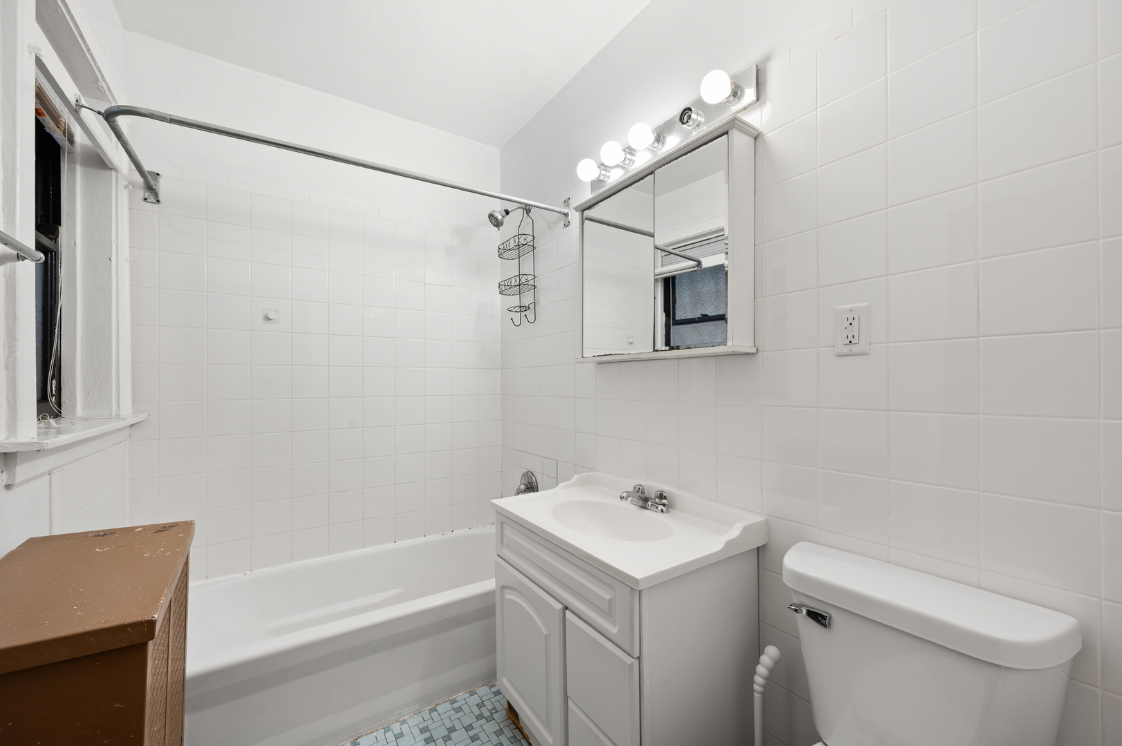 5256 West Wolfram Street, Unit 2 Chicago, IL 60641 - Photo 11 of 11 a bathroom with a sink a toilet and shower