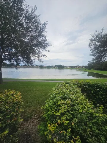 a view of a lake with a big yard