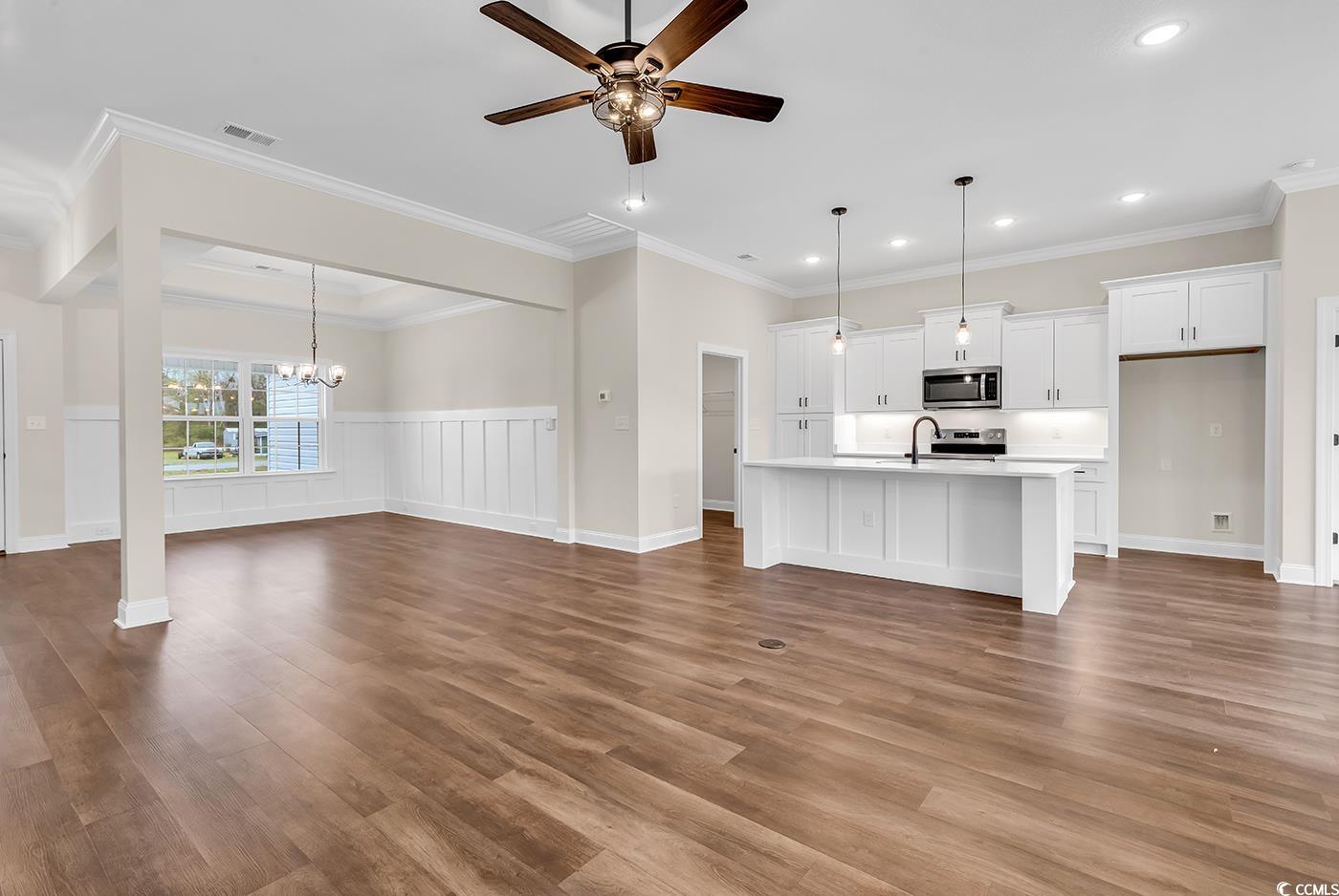 3538 Good Luck Road Aynor, SC 29511 - Photo 16 of 34 Unfurnished living room featuring crown molding, a