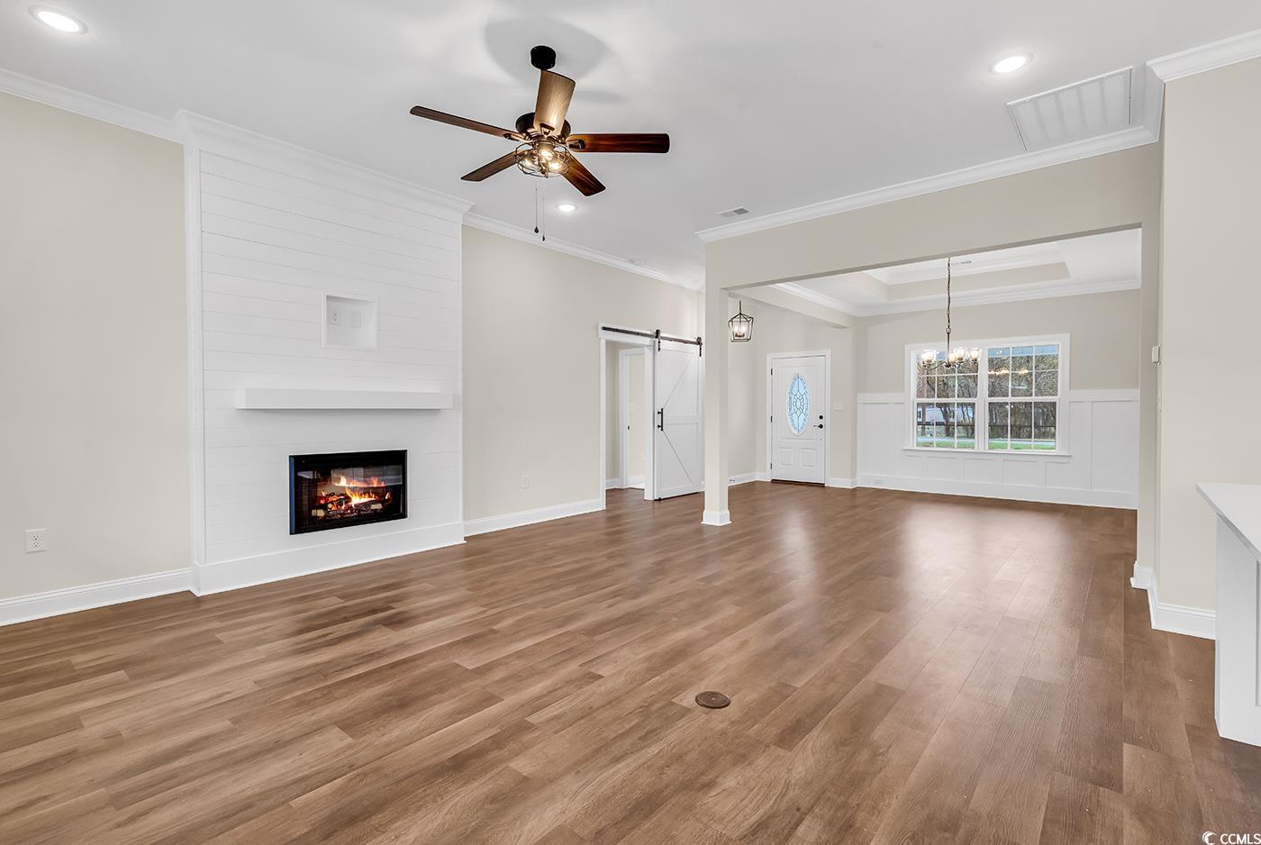 3538 Good Luck Road Aynor, SC 29511 - Photo 17 of 34 Unfurnished living room with crown molding, a barn
