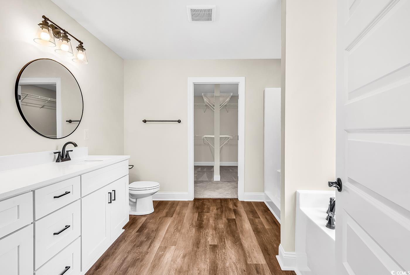 3538 Good Luck Road Aynor, SC 29511 - Photo 23 of 34 Bathroom with vanity, a spacious closet, toilet, v