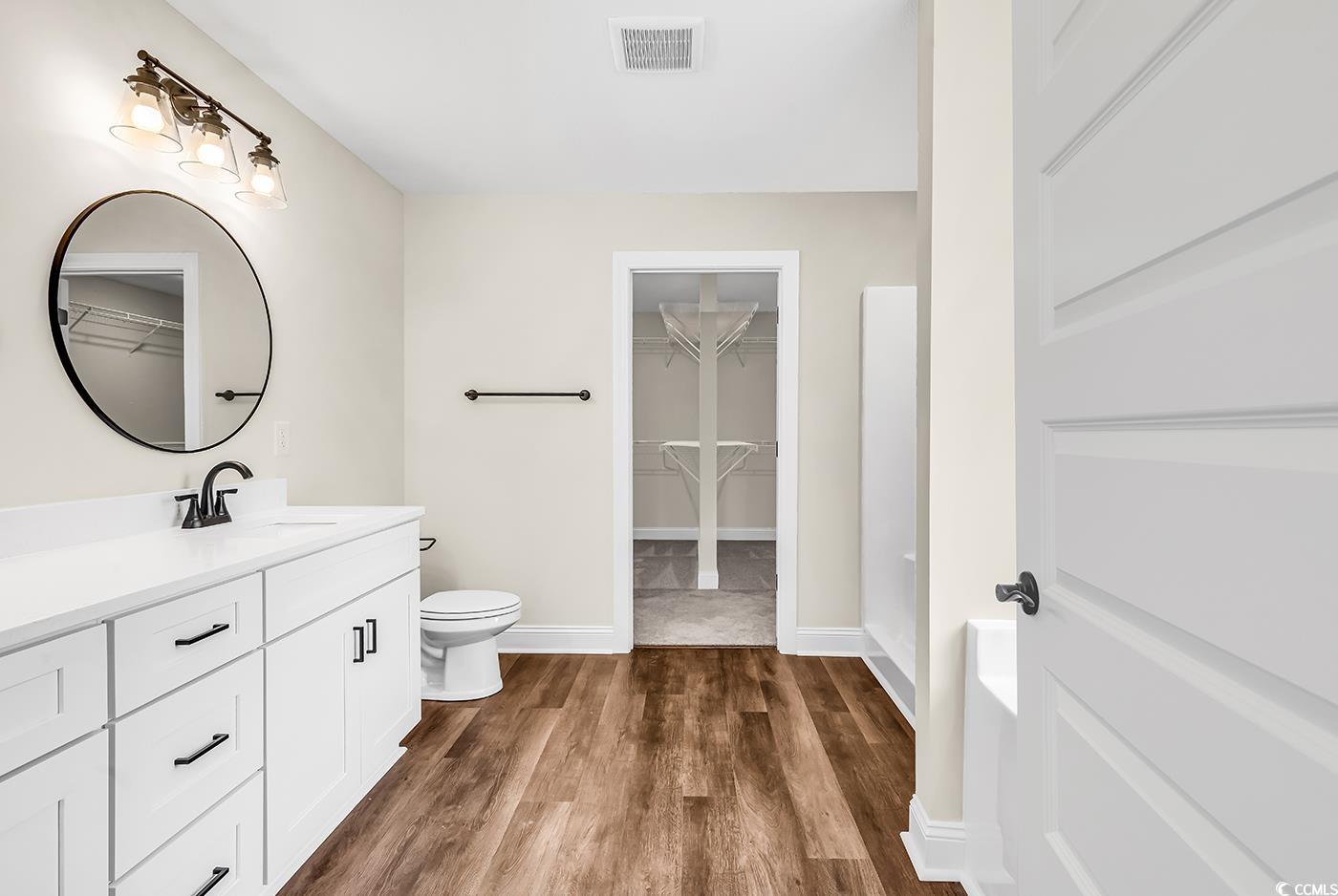 3538 Good Luck Road Aynor, SC 29511 - Photo 24 of 34 Full bathroom featuring toilet, vanity, wood finis