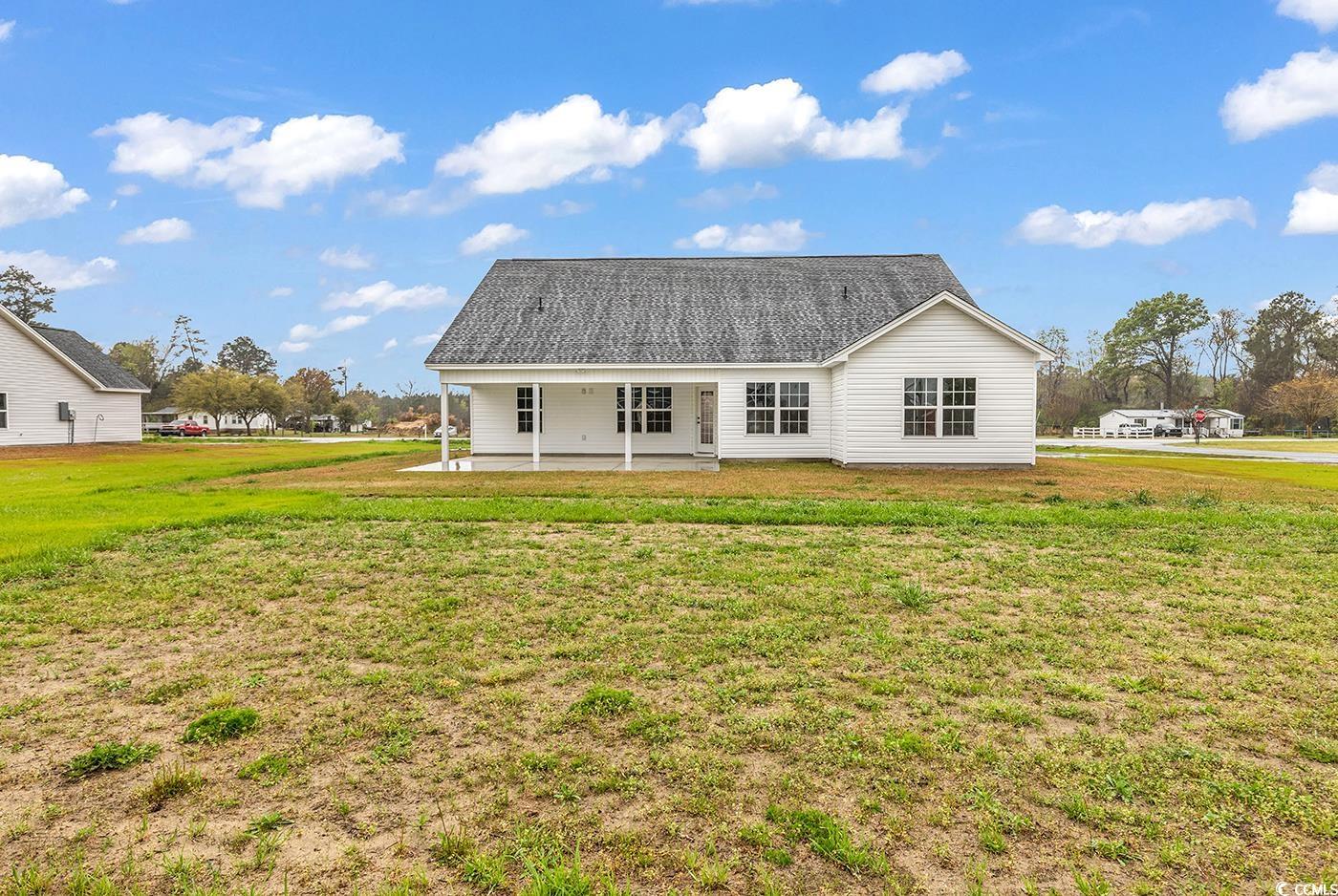 3538 Good Luck Road Aynor, SC 29511 - Photo 5 of 34 Back of property featuring a lawn and a patio area