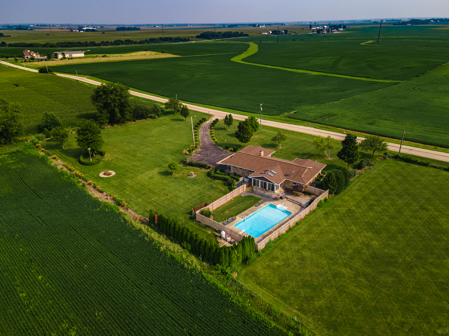 7961 Base Line Road Kingston, IL 60145 - Photo 2 of 55 an aerial view of a golf course with a lake view