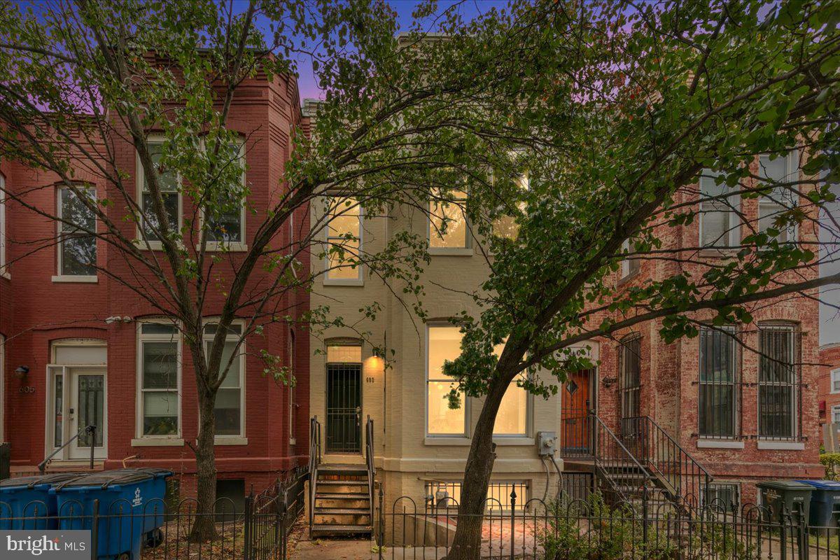 a view of a house with a tree