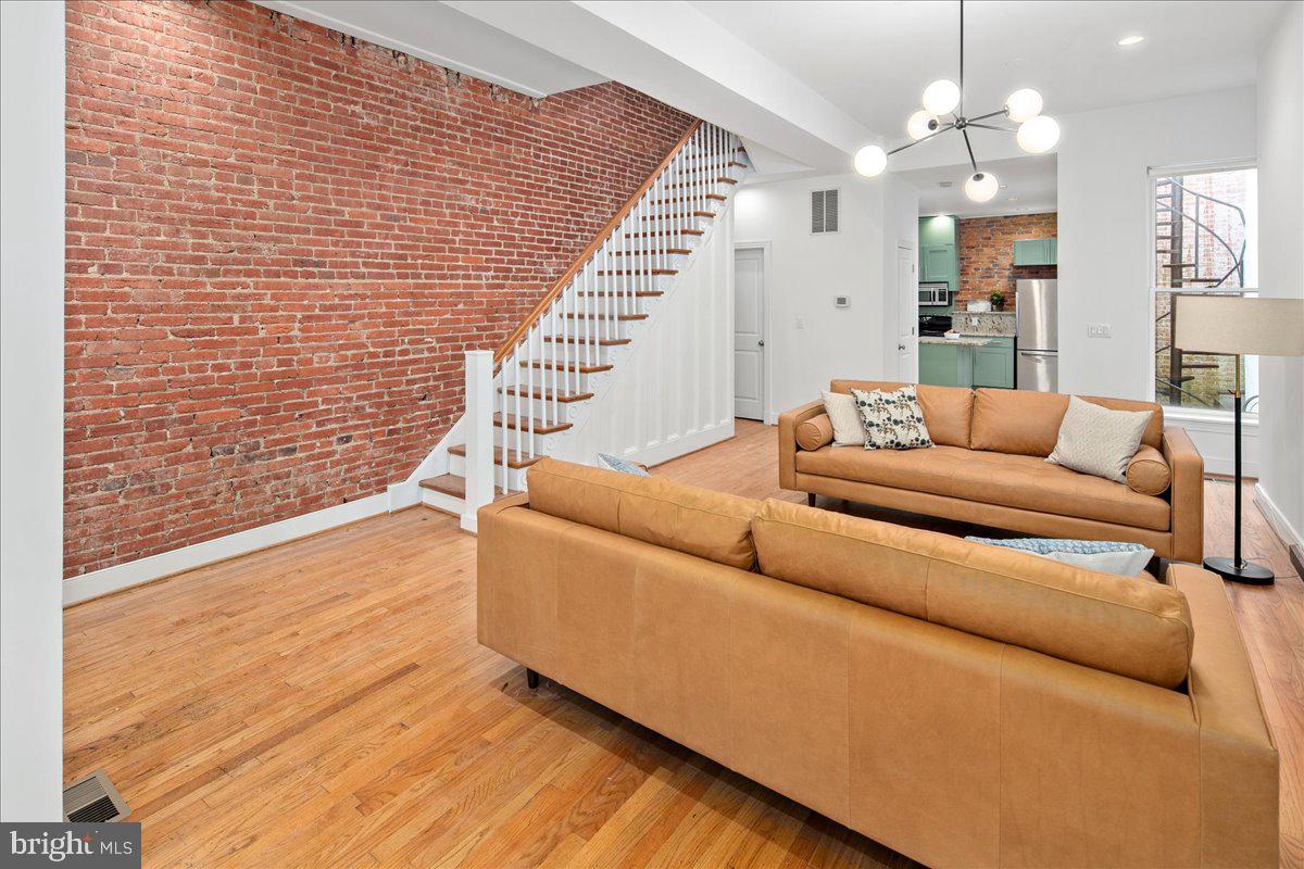 603 P Street Northwest Washington, DC 20001 - Photo 15 of 57 a living room with furniture and a chandelier