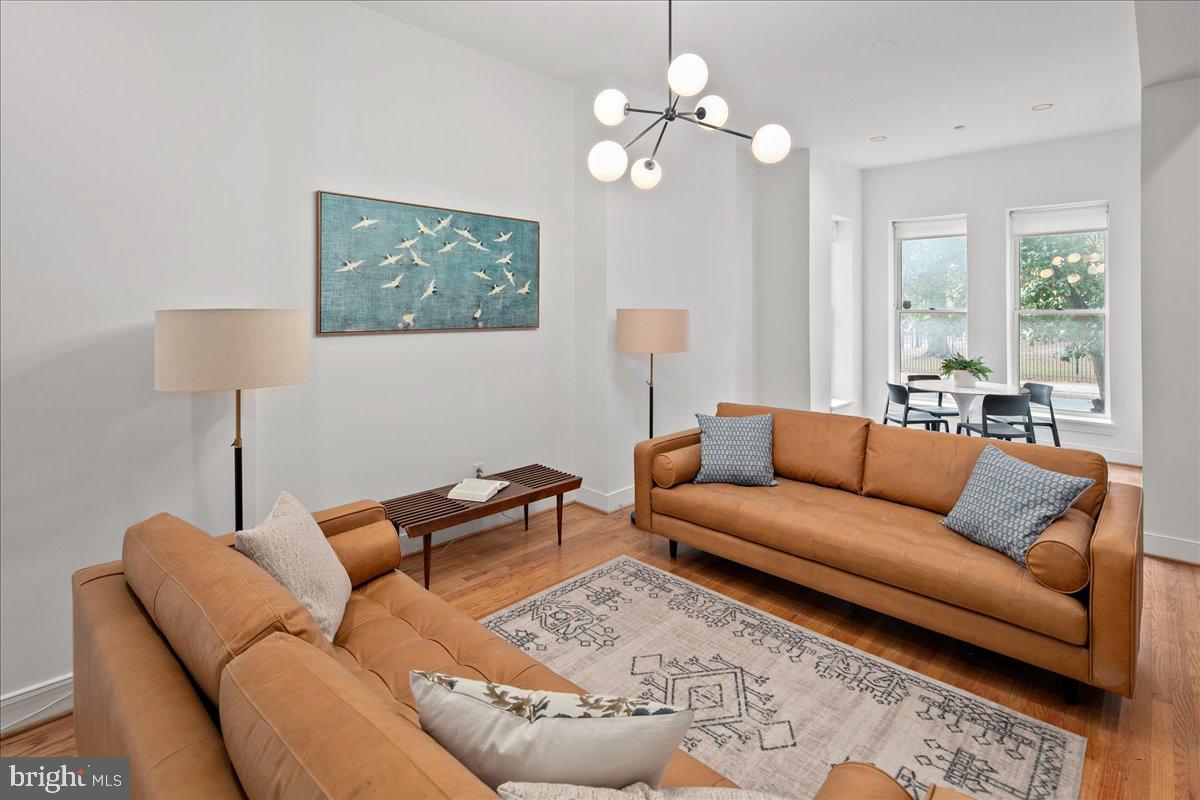 603 P Street Northwest Washington, DC 20001 - Photo 22 of 57 a living room with furniture a large window and a lamp