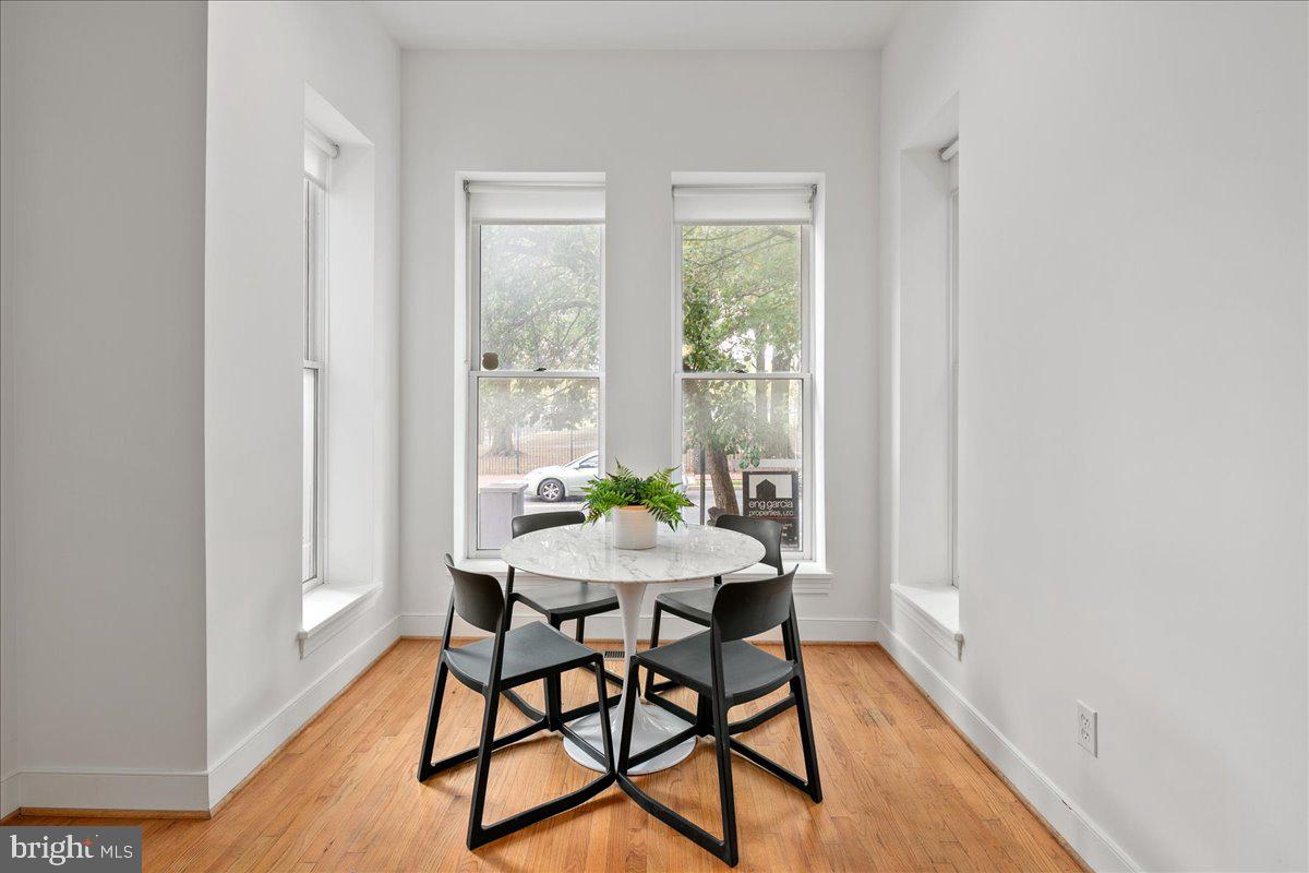 603 P Street Northwest Washington, DC 20001 - Photo 23 of 57 a view of a dining room with furniture and wooden floor