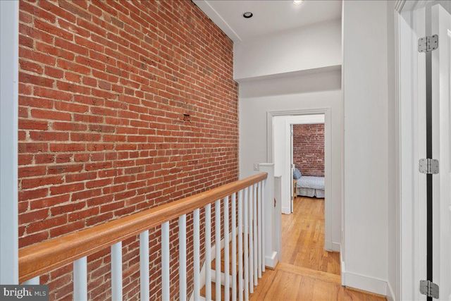 a bathroom with a granite countertop sink and shower
