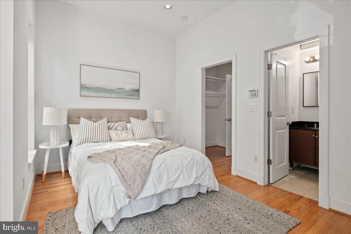 603 P Street Northwest Washington, DC 20001 - Photo 31 of 57 a bedroom with a bed and a painting on the wall