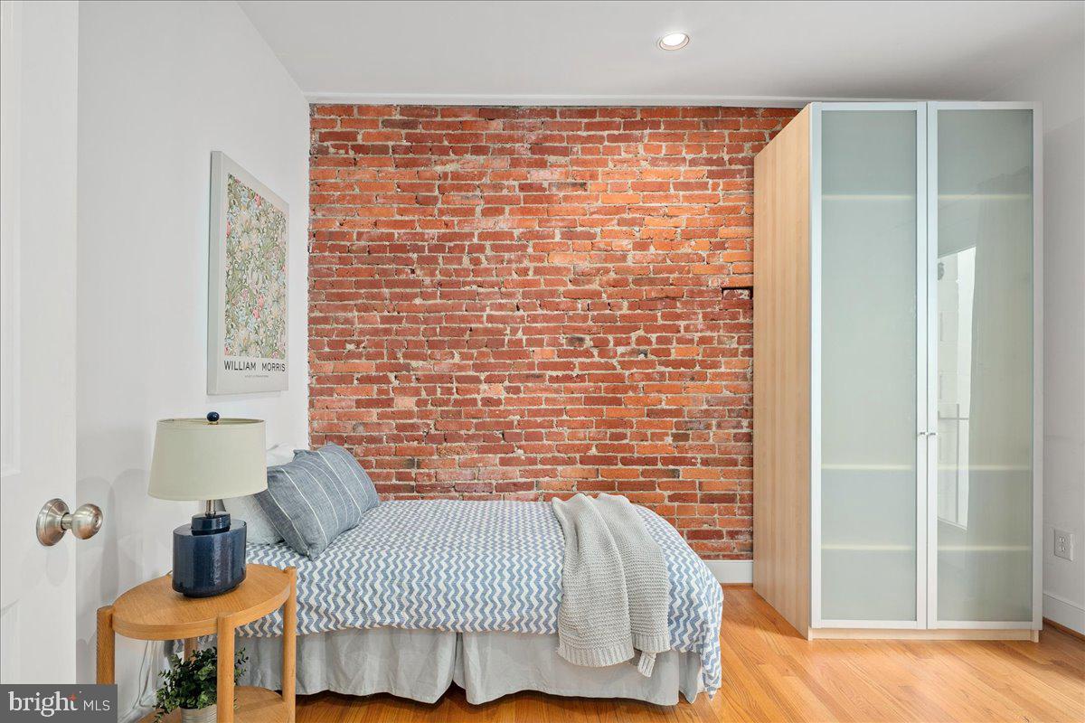 603 P Street Northwest Washington, DC 20001 - Photo 40 of 57 a bedroom with a bed and wooden floor