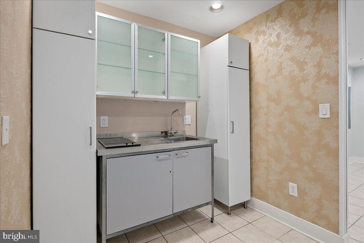 603 P Street Northwest Washington, DC 20001 - Photo 46 of 57 a bathroom with a granite countertop sink and shower