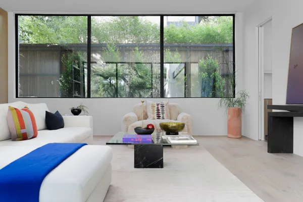 a living room with furniture and a large window