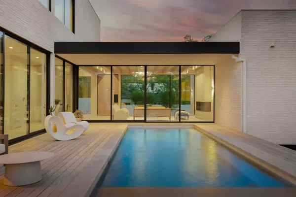 a room with wooden floor and a large window